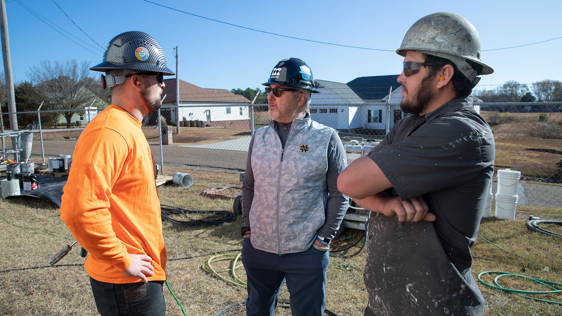 Gene Jones, Jr. visiting a water tank maintenance project.